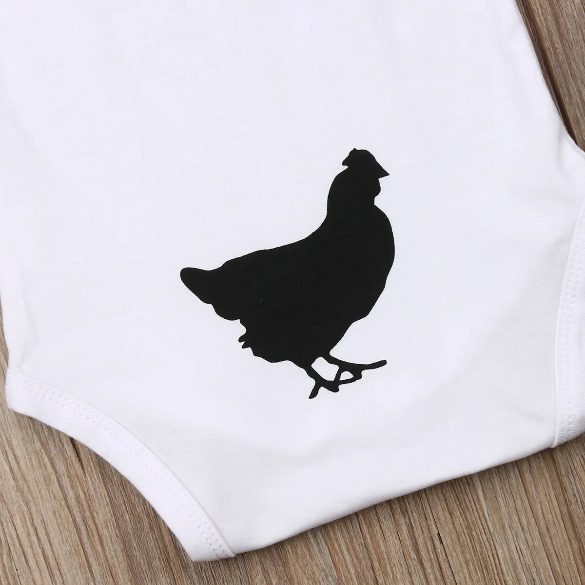 Playful “Guess What?” Baby Onesie