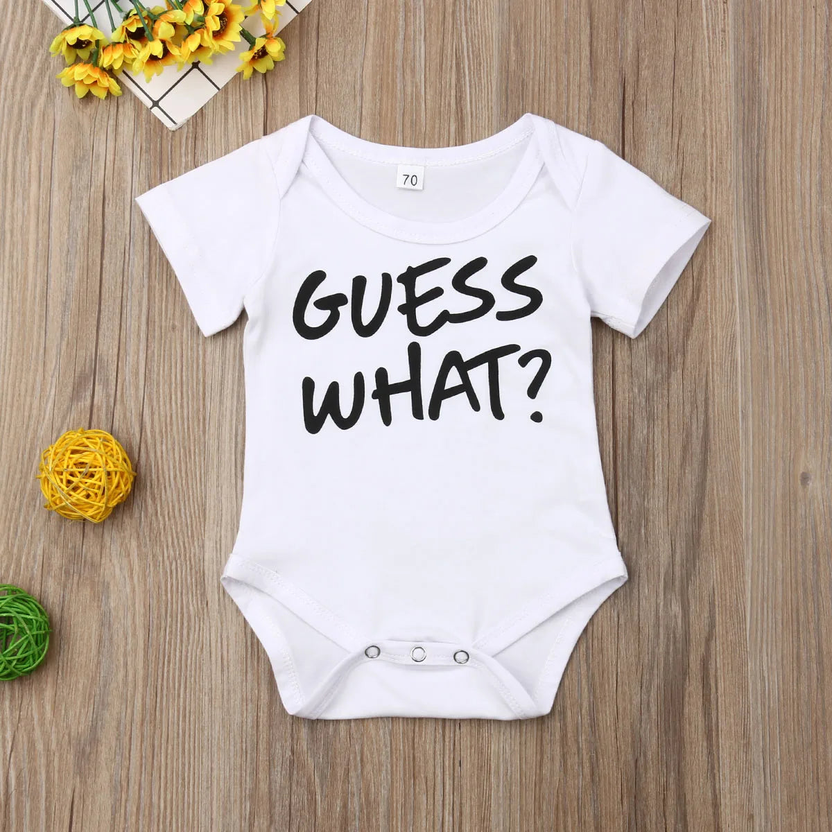 Playful “Guess What?” Baby Onesie